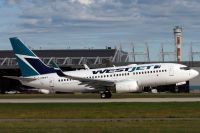 YUL070729_C-FMWJ_B737W_WestJet.jpg